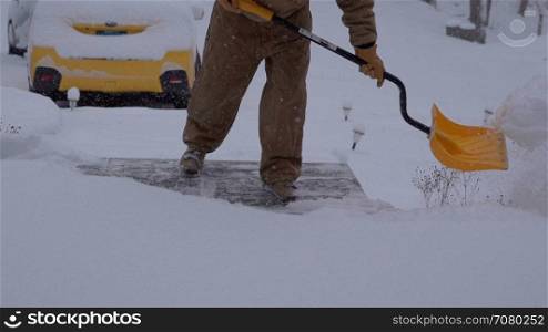 View of a man shoveling snow