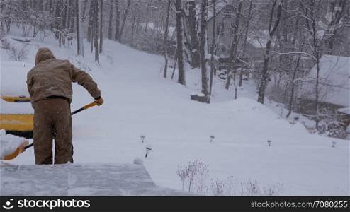 View of a man shoveling snow