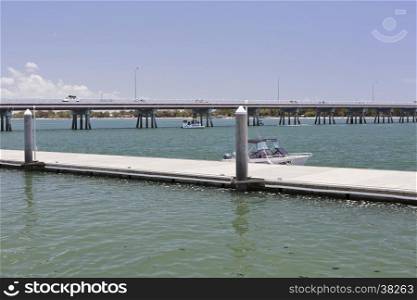 View of a new recreational pier and floating dock at the Pumicestone Passage near the bridge to the Bribie Island, Queensland, Australia