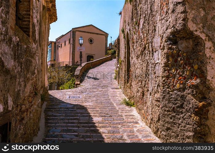 View of a small Sicilian village. Ancient stone road