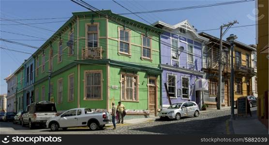 View of a street with cars and colorful buildings, Valparaiso, Chile
