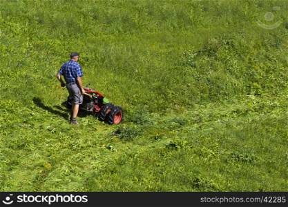 View of a thresher while mower in Seiser Alm