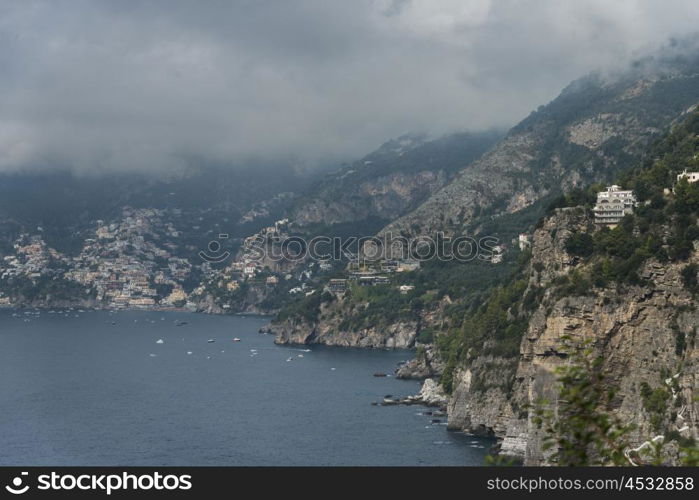 View of a town at coast, Praiano, Amalfi Coast, Salerno, Campania, Italy
