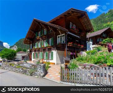 View of a traditional mountainous Swiss village. Switzerland.. Old wooden houses in a swiss village.