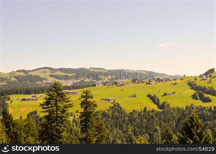 View of a valley and green . View of a valley and green hills in the Austrian Tyrol