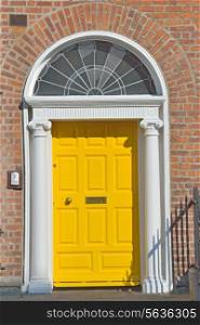 View of a Yellow Georgian door in Dublin Ireland