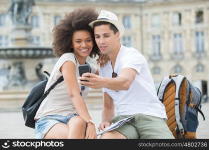 view of a young couple on holidays taking selfie