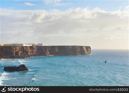 View of Algarve shore with Sagres Fort on a cliff. Portugal