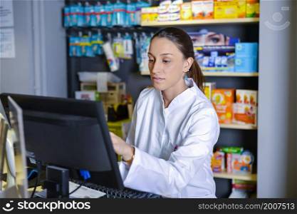 View of attractive pharmacist at work. View of an attractive pharmacist at work