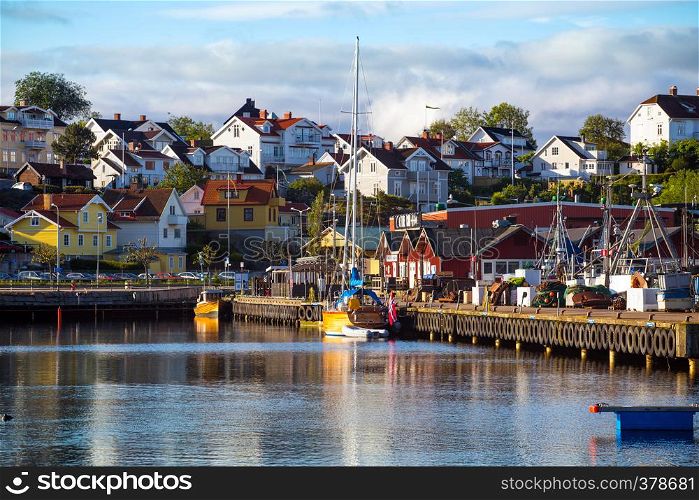 View of bay of morning in a small Swedish town, Sweden. houses and ships against the sky