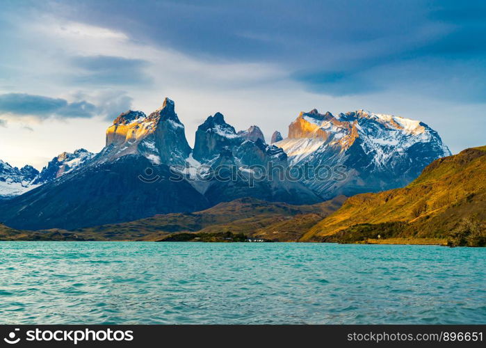 View of beautiful Cuernos del Paine Mountains and Lake Pehoe in Torres del Paine National Park in the evening, Chile