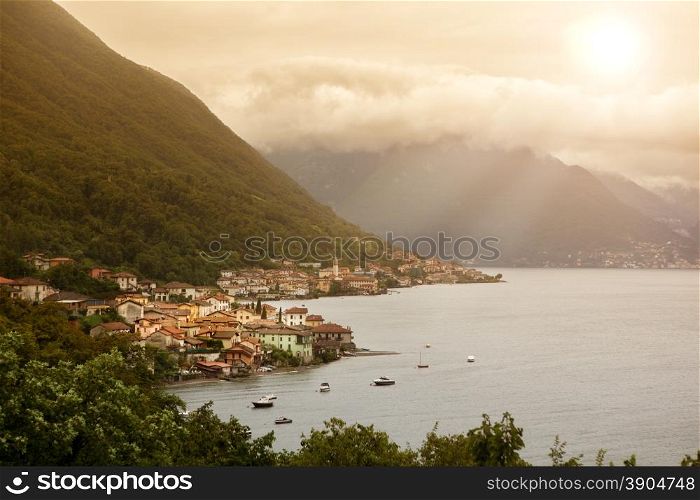 View of beautiful italian village on Como lake in sunlight