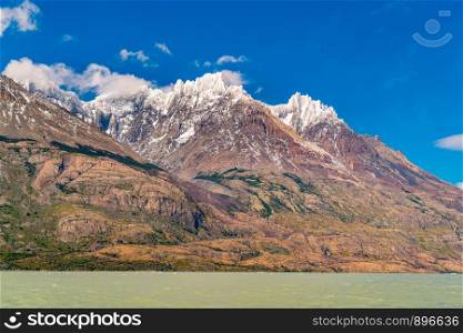 View of beautiful snow capped mountain and Lake Grey in Torres del Paine National Park in Chile