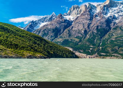 View of beautiful snow mountain on the shore of Lake Grey in Torres del Paine National Park in Chile