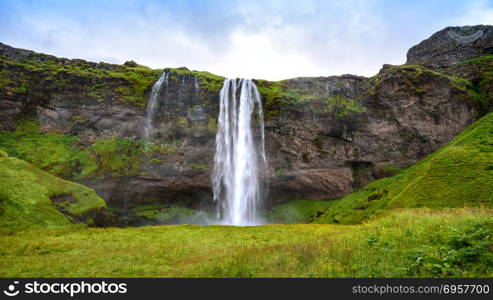 view of beautiful waterfall Seljalandsfoss in summer, south Iceland. waterfall Seljalandsfoss in summer, Iceland