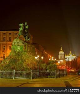 View of Bohdan Khmelnytsky monument and St. Michael&rsquo;s Golden-Domed Monastery inthe background at night. Kyiv, Ukraine