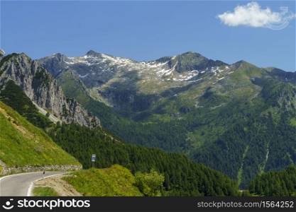View of Breno, Brescia, Lombardy, Italy, from the road to Crocedomini pass at summer. Mountain landscape.