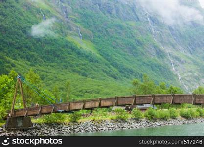 View of bridge in Gudvangen, Norway. Tourism vacation and travel. Mountains landscape and fjord Sognefjord. Misty foggy day. View of bridge in Gudvangen, Norway