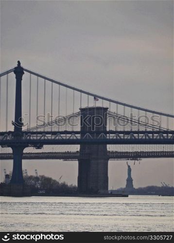 view of Brooklyn Bridge, Manhattan Bridge and Statue of Liberty in New York City