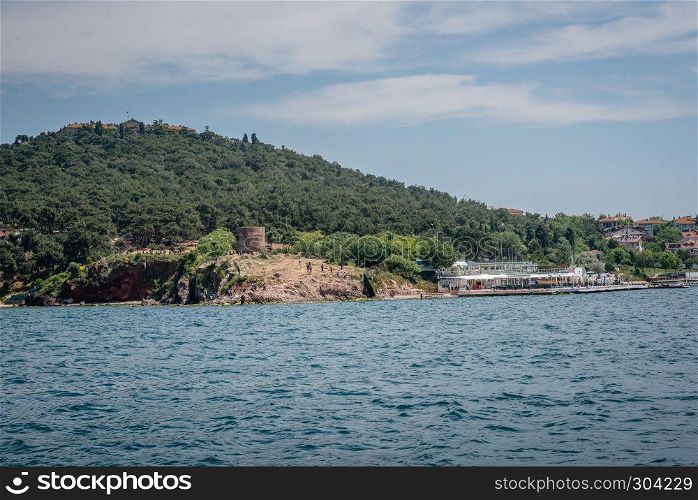 View of Burgazada island from the sea.The island is one of four islands named Princes Islands in the Sea of Marmara, near Istanbul, Turkey.20 May 2017. View of Burgazada island from sea in Istanbul,Turkey