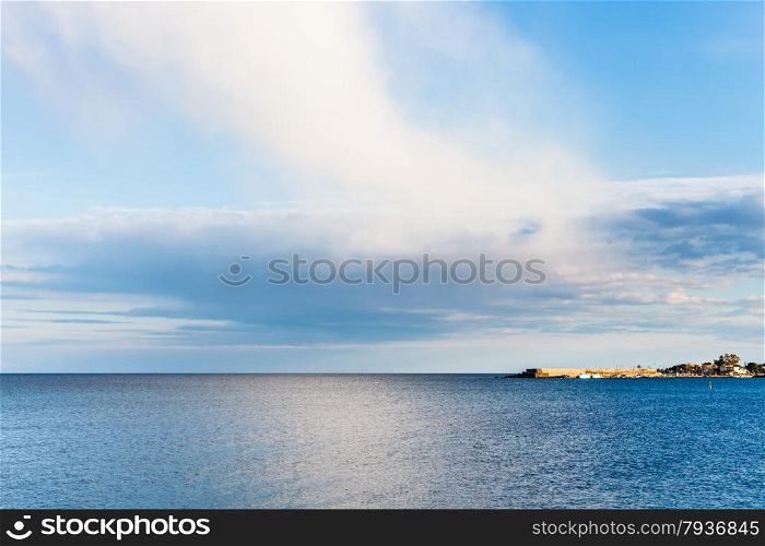 view of calm Ionian Sea near Giardini Naxos resort after rain in spring, Sicily