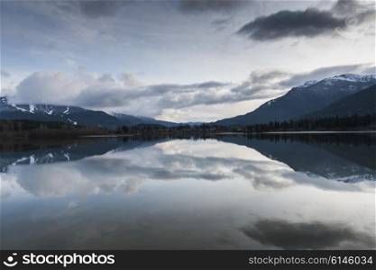 View of calm lake with mountains, Whistler, British Columbia, Canada