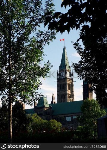 View of Canada&acute;s Parliament Buildings through the trees.