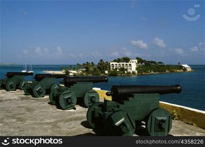 View of cannons with a fort seen in the background, Christiansvaern fort, St. Croix, U.S. Virgin Islands