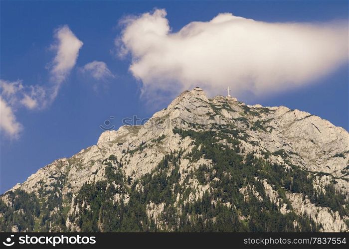 view of caraiman heroes cross monument in bucegi mountains romania. cross on a mountaintop