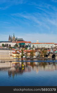 View of Charles bridge over Vltava river and Gradchany Prague Castle and St. Vitus Cathedral