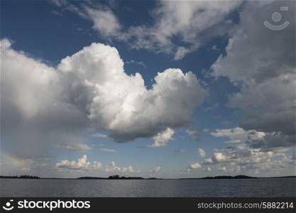 View of clouds over a lake, Lake of the Woods, Ontario, Canada