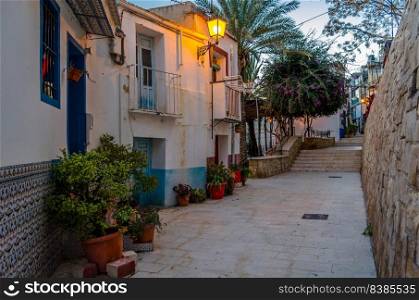 View of colorful houses and narrow streets in the old Mediterranean town of Alicante, Spain