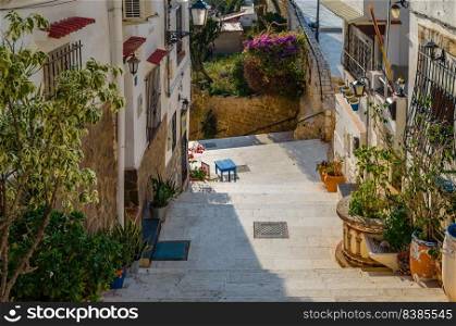 View of colorful houses and narrow streets in the old Mediterranean town of Alicante, Spain