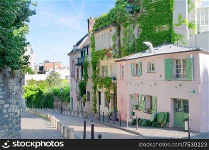 View of cosy street in quarter Montmartre in Paris, France. Cozy cityscape of Paris at summer. Architecture and landmarks of Paris.. cityscape Mont Matre , Paris, France