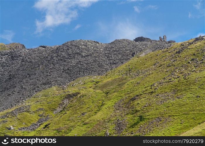 View of Croesor Slate Mine spoil heaps and ruined huge drum house for incline. Snowdonia National Park, Gwynedd, Wales, United Kingdom.