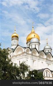 view of cupolas Cathedral of the Archangel and Bell Tower in Moscow Kremlin