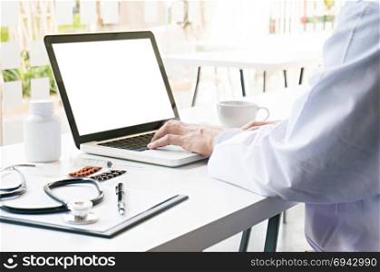View of Details of doctor hands typing on keyboard with blank screen