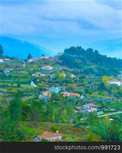 View of Douro river valley villages in rainy weather. Portugal