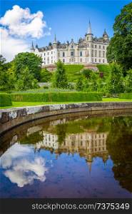 View of Dunrobin Castle with reflection in the pond; Scotland