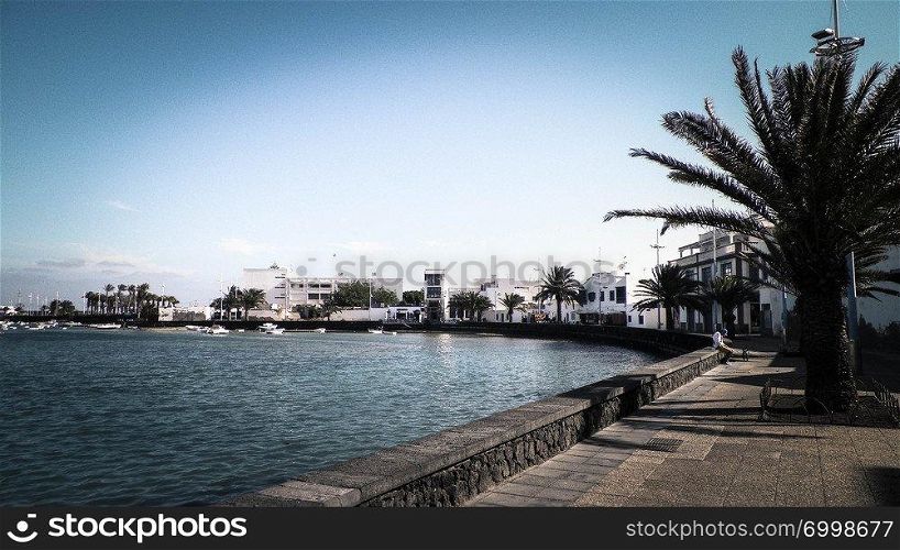 View of El Charco de San Gines, the beautiful marina in Arrecife City. Canarian Architecture, and it’s tropical nature.. View of El Charco de San Gines, Lanzarote island.