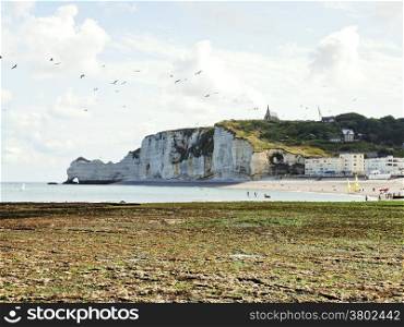 view of Eretrat village and cliff on english channel beach of cote d&rsquo;albatre, France