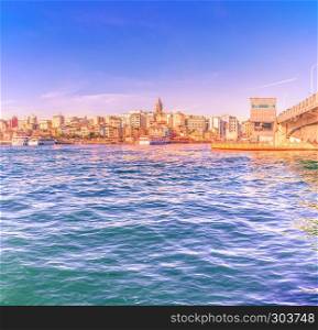 View of famous Galata tower with Bosphorus in sunny day.Istanbul,Turkey. View of famous Galata tower in Istanbul