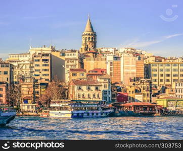 View of famous Galata tower with Bosphorus in sunny day.Istanbul,Turkey. View of famous Galata tower in Istanbul