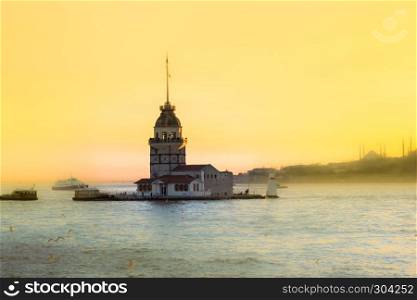 View of famous Maiden Tower,a medieval building and lighthouse and bosphorus,Istanbul,Turkey. View of famous Maiden Tower,a medieval building