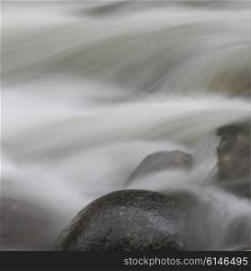 View of fast moving water over rocks in river, Whistler, British Columbia, Canada