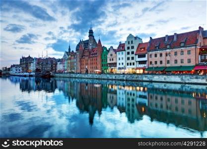 View of Gdansk old town and Motlawa river, Poland at romantic sunset. The city also known as Danzig and the city of amber.