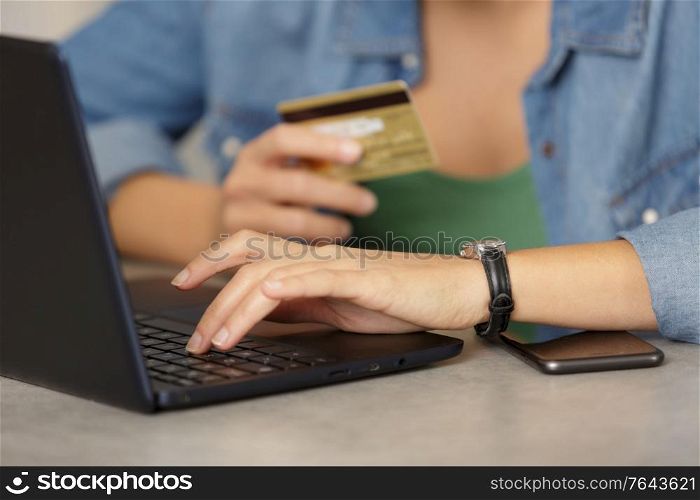 view of hands using credit card for online shoping