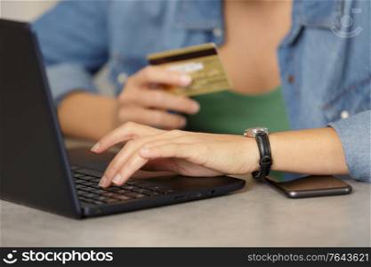view of hands using credit card for online shoping
