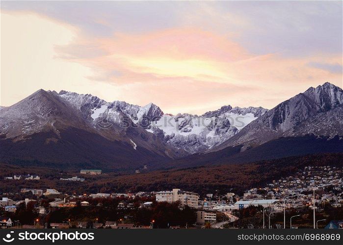 View of houses with snowy mountains at the back in Ushuaia, Patagonia, Argentina.