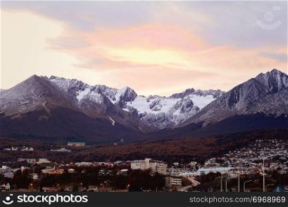 View of houses with snowy mountains at the back in Ushuaia, Patagonia, Argentina.
